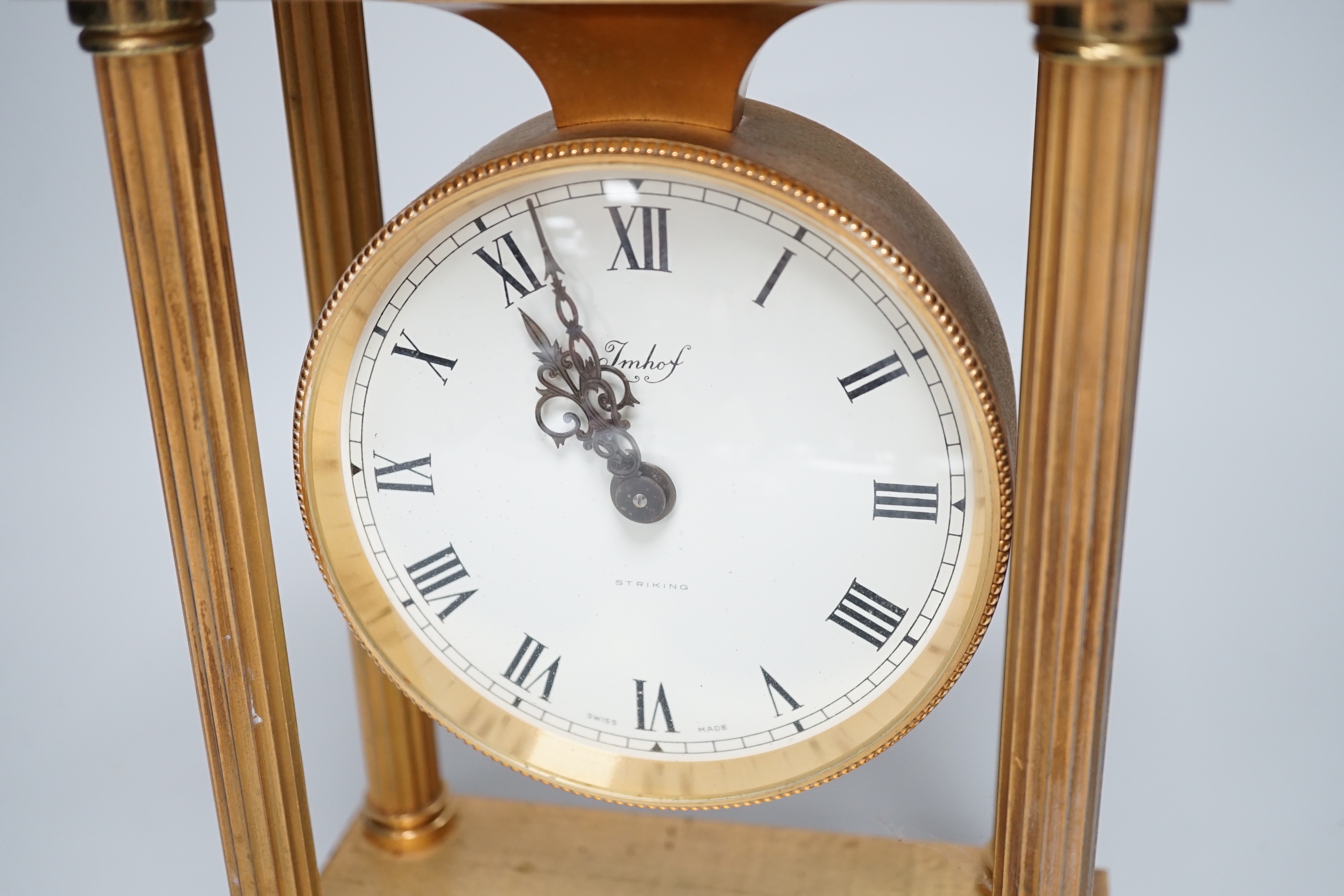 Imhof Swiss brass mantel clock with two train movement, striking on a bell, 24cm high